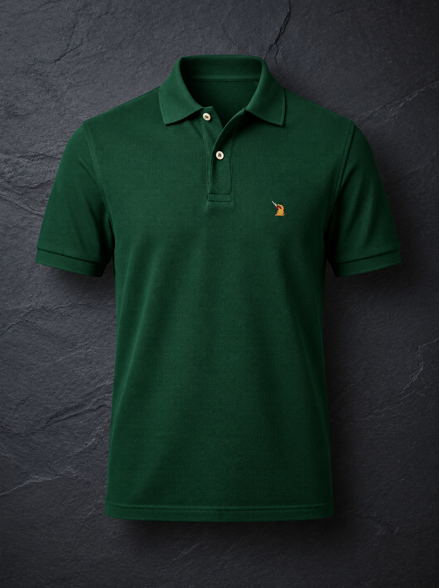 The St John Parker polo in bottle green piqué, the embroidered bird at the left chest.